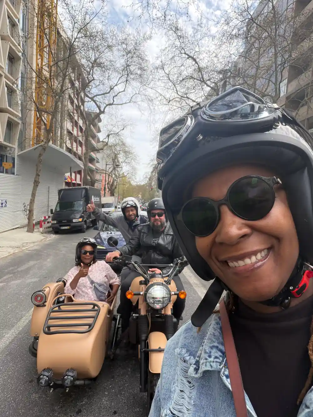 A rider photographing herself from the chair with a second sidecar behind