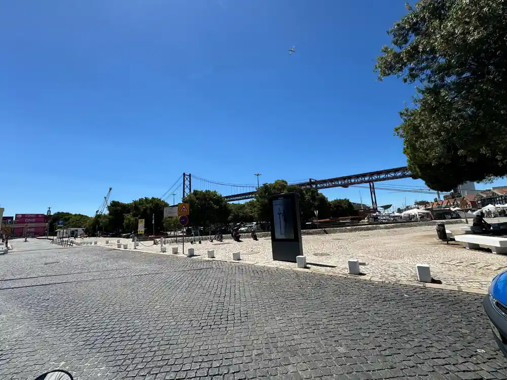 The riverside promenade with the suspension bridge and harbour cranes