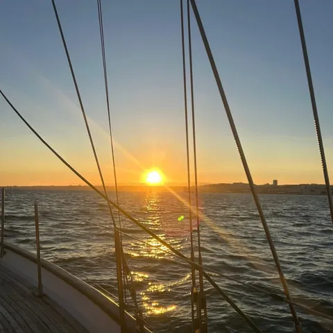 Sunset over the Tagus from a sailing boat